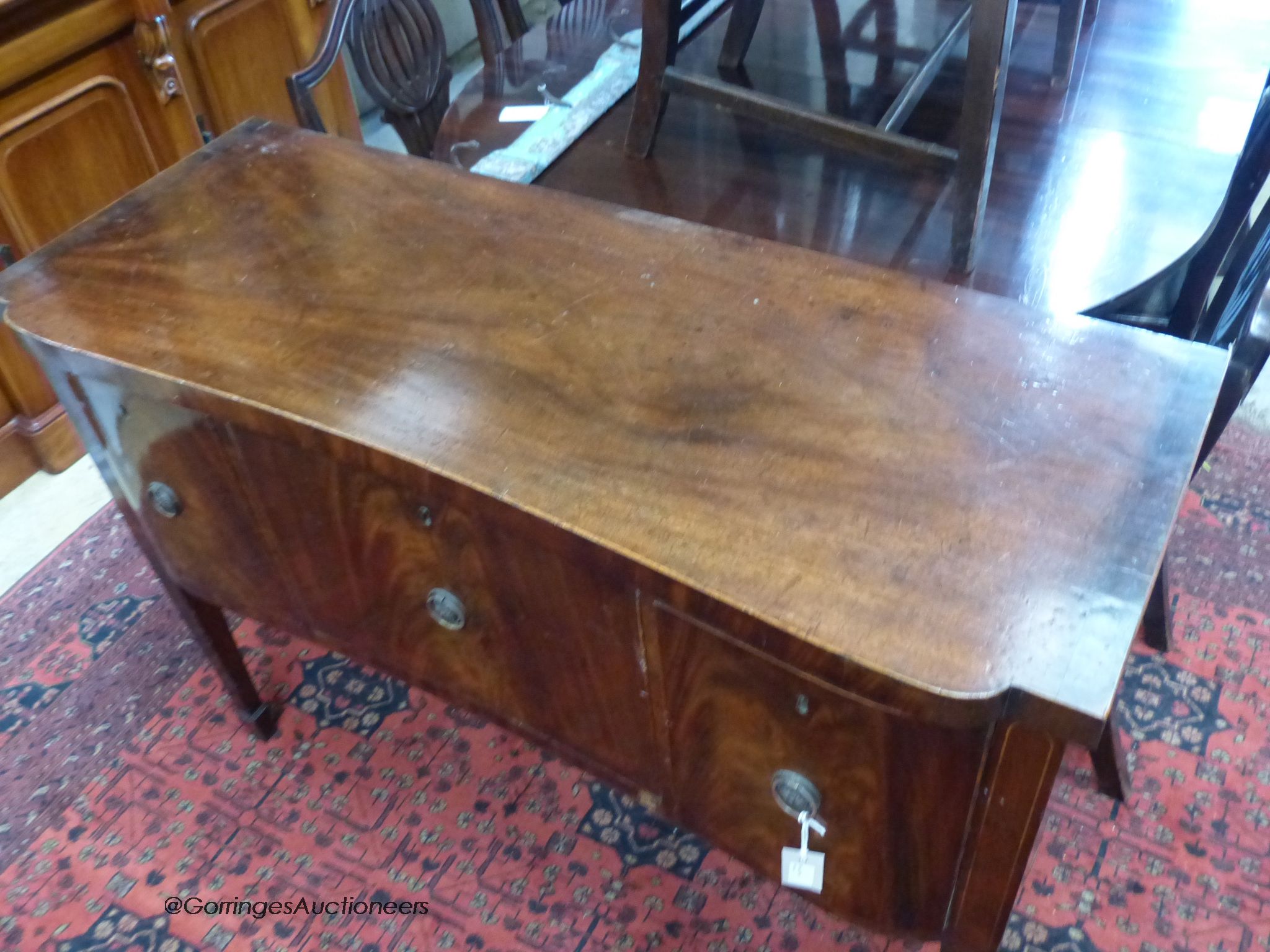 A George III mahogany sideboard of small proportions, length 117cm, depth 45cm, height 87cm